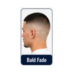 Modern bald fade hairstyle with fully shaved sides and slightly longer hair on the upper section.