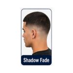 Shadow fade hairstyle with soft dark blending on the sides and short hair on top.