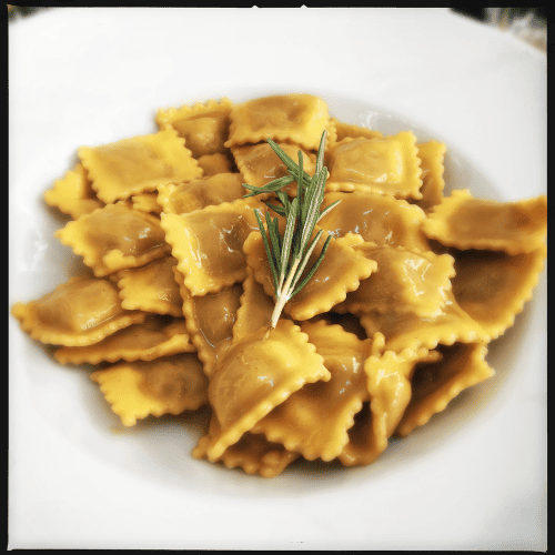 Agnolotti pasta with small rectangular filled pockets.