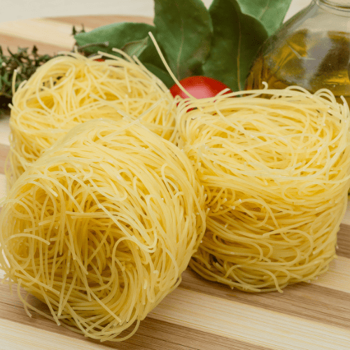 Capellini pasta with extremely thin, delicate strands.