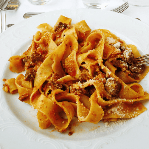Pappardelle pasta with very wide, flat ribbon-shaped strands.