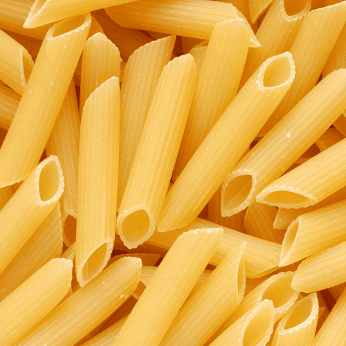 Penne rigate pasta with short ridged tubes and diagonal ends.
