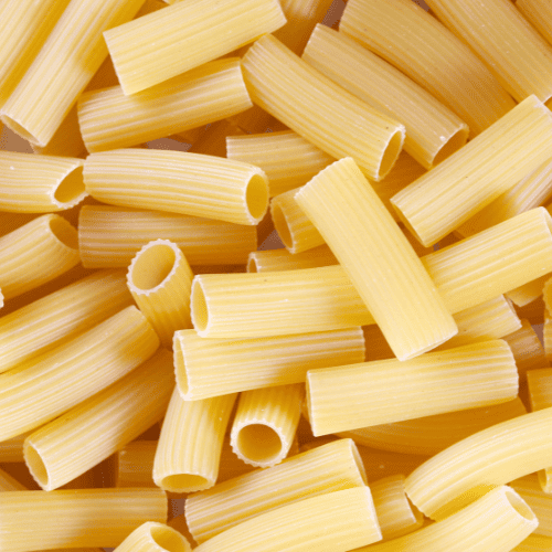 Rigatoni pasta with large ridged tubes and wide openings.